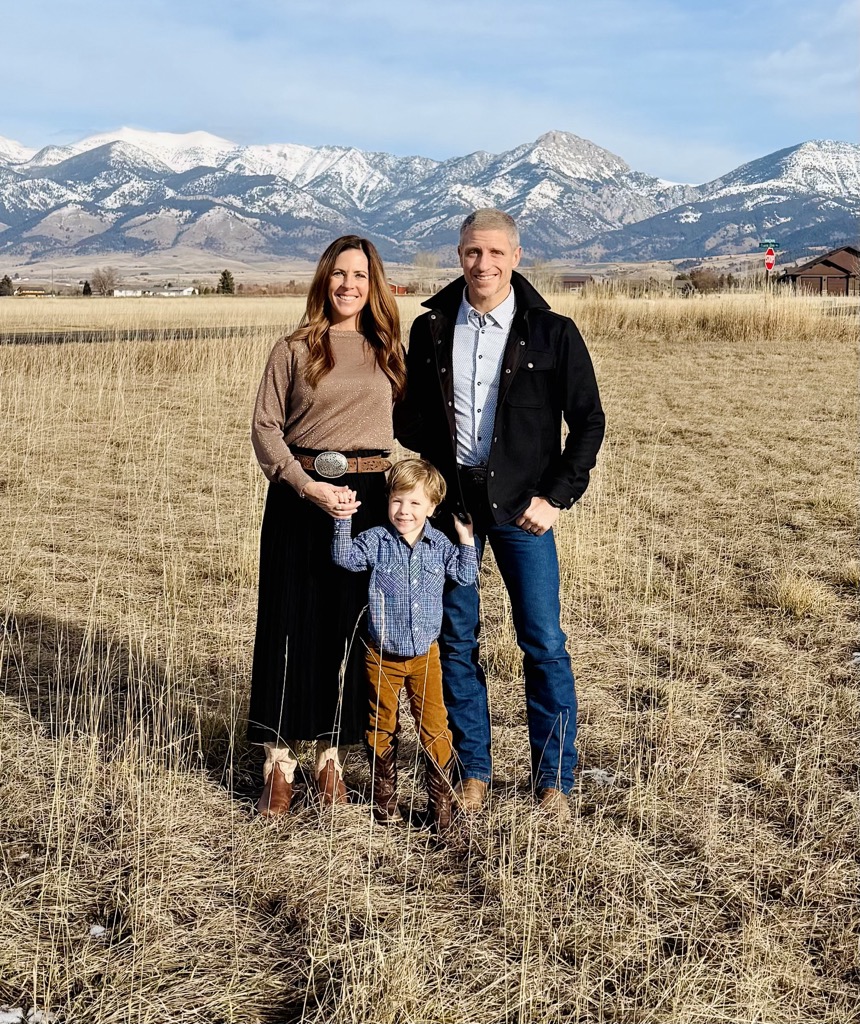 Dusty, Ashley, and family in front of the Bridger Mountains in Bozeman, Montana